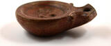 40-100AD A Roman terracotta volute oil lamp.