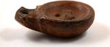 40-100AD A Roman terracotta volute oil lamp.
